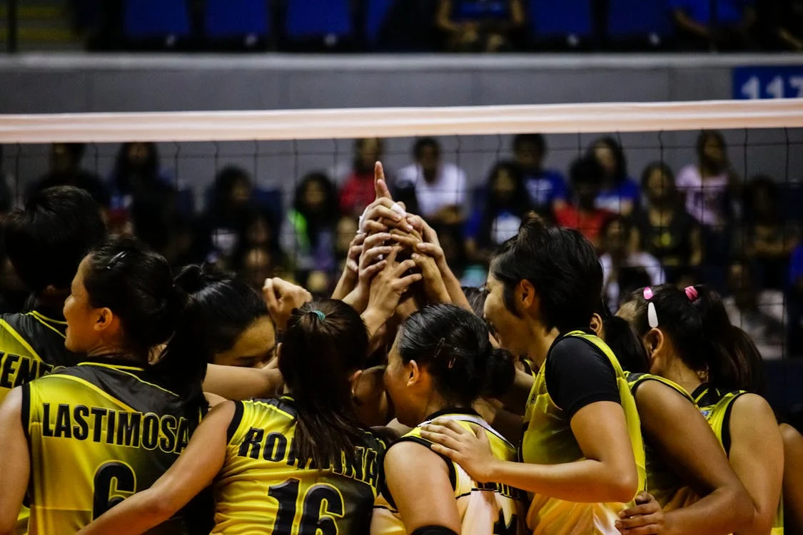 volleyball team cheering each other